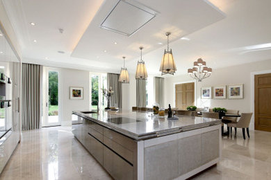 This is an example of a contemporary kitchen/diner in Other with white cabinets and an island.
