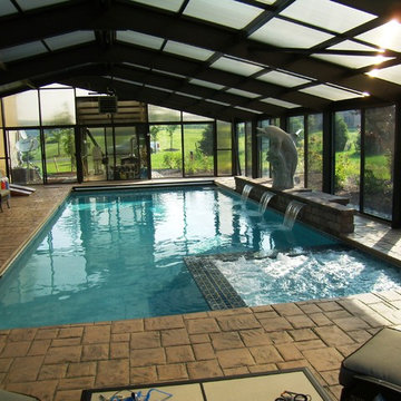 Indoor pool with raised wall and sheer descent waterfalls in Williams Township
