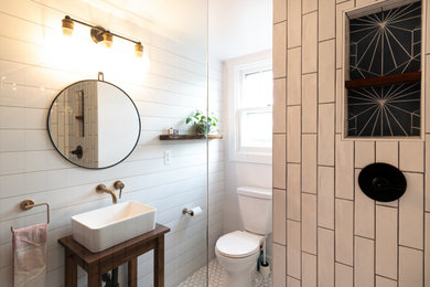 Design ideas for a small country 3/4 bathroom in Baltimore with brown cabinets, an open shower, a two-piece toilet, white tile, ceramic tile, white walls, cement tiles, a vessel sink, wood benchtops, white floor, an open shower, brown benchtops, a niche, a single vanity and a freestanding vanity.