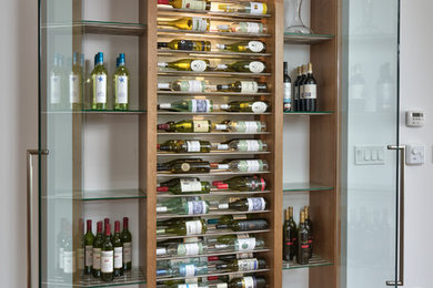 Small minimalist wine cellar photo in Other