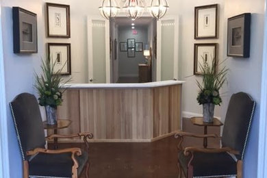 Example of a large trendy vinyl floor entryway design in Miami with white walls and a glass front door