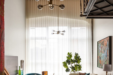 Living room - industrial living room idea in Seattle