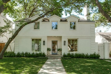 Large elegant beige two-story brick exterior home photo in Dallas