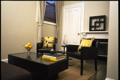 Small trendy enclosed dark wood floor living room photo in San Francisco with beige walls, a standard fireplace and a wood fireplace surround