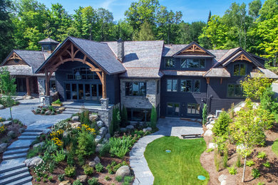 Example of an arts and crafts two-story mixed siding gable roof design in Toronto