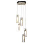 Hubbardton Forge - Hubbardton Forge 131124-STND-05-ZM Exos Glass 5-Light Pendant in Bronze - The Exos Collection has a new addition with five cascading pendants clustered on a round multi-port canopy. Individual pendant lengths are customizable to suit the space, making this Exos Glass 5-Light pendant and easy choice. With a substantial range of cable length, this Exos Glass ceiling pendant could make a dramatic statement as a semi-flush or as a cascading focal piece. Tall, vertical, handcrafted steel pieces embrace a glass shade in a choice of opal or clear glass, with an opal inner diffuser.