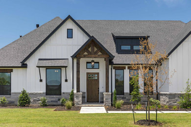 Design ideas for a large country two-storey exterior in Dallas.