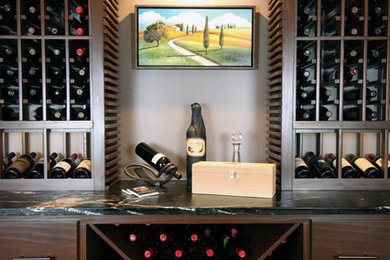 Inspiration for a transitional wine cellar in Columbus with limestone floors and black floor.