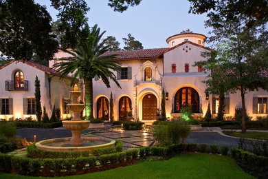 Huge tuscan white three-story stucco house exterior photo in Houston