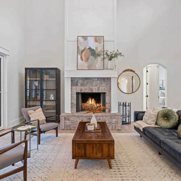 Cozy Modern Farmhouse Living Room: Stone Fireplace, Vaulted Ceilings, Loft Libra
