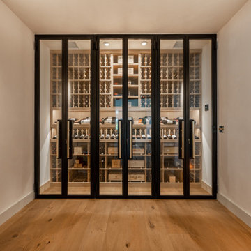 Rancho Sante Fe Custom Wine Wall and Steel Doors with Bronze Handles