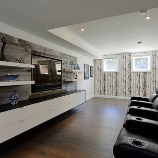 Photo of a large contemporary enclosed home cinema in Toronto with white walls, dark hardwood flooring and a built-in media unit.