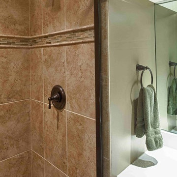 Bathroom With White Vanity and Quartz Top and Tiled Shower