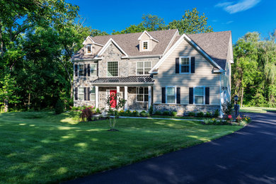 Mid-sized elegant brown gable roof photo in Philadelphia