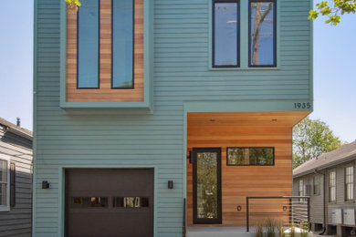 Inspiration for a contemporary two-story clapboard exterior home remodel in New Orleans