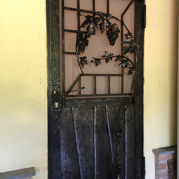 Porta in ferro battuto "TRALCIO DI VITE"