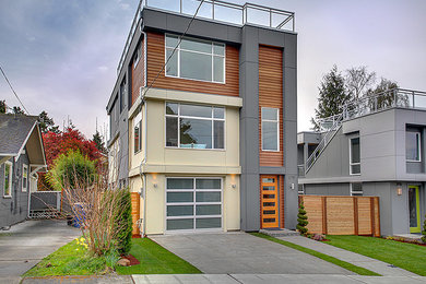 Inspiration for a large modern gray three-story concrete fiberboard exterior home remodel in Seattle