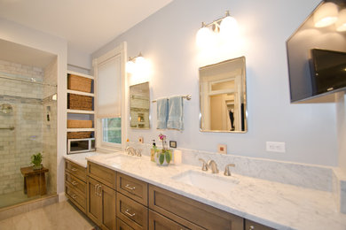 Design ideas for a large transitional master bathroom in DC Metro with shaker cabinets, medium wood cabinets, an alcove shower, a two-piece toilet, gray tile, stone tile, blue walls, porcelain floors, an undermount sink and marble benchtops.