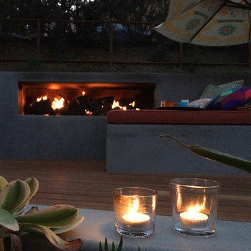 Mangaris Wood Deck and Custom Outdoor Fireplace filled with volcanic rock