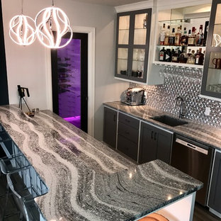 Medium sized contemporary look-out basement in Other with grey walls, ceramic flooring, a standard fireplace, a tiled fireplace surround and grey floors.