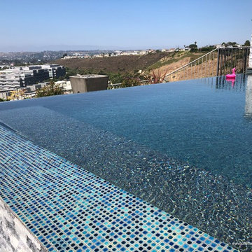Los Angeles - Contemporary Hillside Pool & Spa with Colored Water Spillways