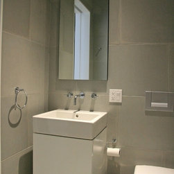 Concrete wall panels and bathroom floor.NYC,NY - Tile