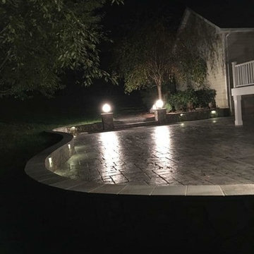 T-Stamped concrete patio, flagstone wall with columns
