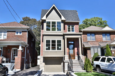 Inspiration for a large contemporary two-storey brick beige exterior in Toronto.