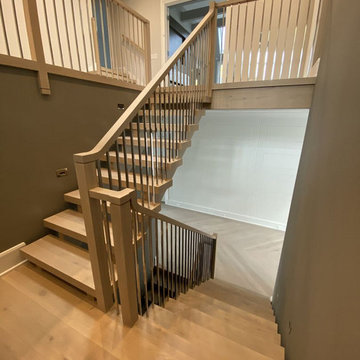 White Oak Stairs with Polished Stainless Steel Balusters