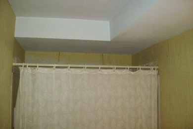 Example of a small classic master beige tile and cement tile ceramic tile bathroom design in Chicago with an integrated sink, furniture-like cabinets, black cabinets, onyx countertops, a two-piece toilet and gray walls