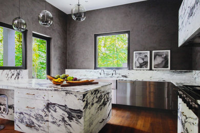 Enclosed kitchen - large contemporary l-shaped dark wood floor and brown floor enclosed kitchen idea in Portland with a farmhouse sink, flat-panel cabinets and an island