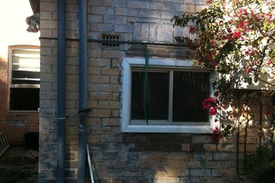 Photo of a contemporary one-storey brick exterior in Sydney.