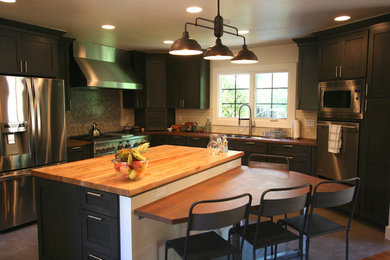 Open concept kitchen - mid-sized transitional u-shaped porcelain tile open concept kitchen idea in Other with a drop-in sink, shaker cabinets, gray cabinets, white backsplash, ceramic backsplash, stainless steel appliances and an island