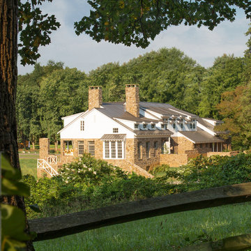 American Farmhouse with Board and Batten and Rustic Stone