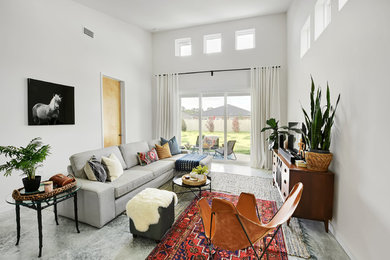 Living room - mid-sized modern open concept concrete floor and gray floor living room idea in Jacksonville with white walls, no fireplace and a tv stand