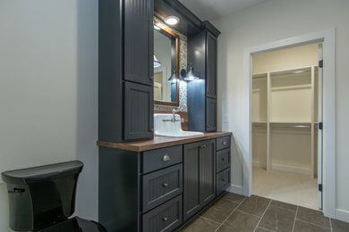 Mid-sized elegant master single-sink bathroom photo