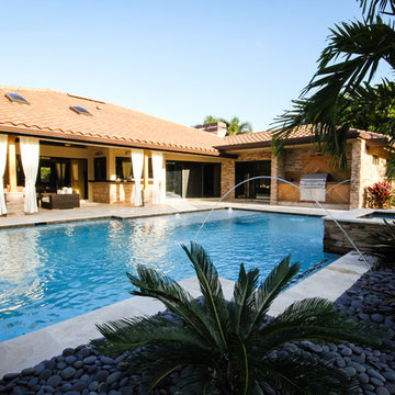 Roman/Geometric Pool with Spa & Water Features Including Sun Shelf in Boynton Be