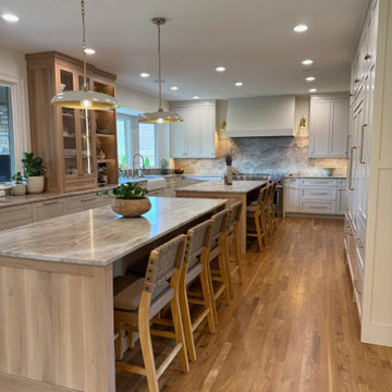 Frameless white perimeter with rift cut oak islands