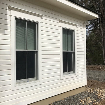 Stone Ridge New Exterior- novelty siding, Red Balau decking, exterior paneling