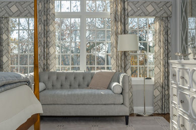 Inspiration for a mid-sized timeless master medium tone wood floor and brown floor bedroom remodel in Bridgeport with gray walls