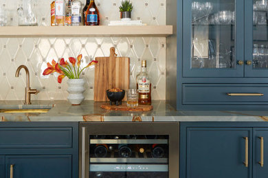 Transitional single-wall light wood floor and beige floor wet bar photo in Chicago with beige backsplash, an undermount sink, shaker cabinets, blue cabinets and gray countertops
