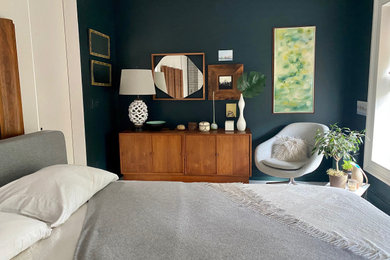 Inspiration for a mid-sized contemporary master light wood floor, gray floor, vaulted ceiling and brick wall bedroom remodel in New York with green walls, a standard fireplace and a brick fireplace