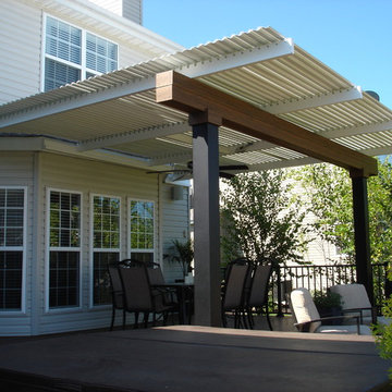 Deck with louvered roof, fire feature, and inset hot tub - Dardenne Prairie, MO