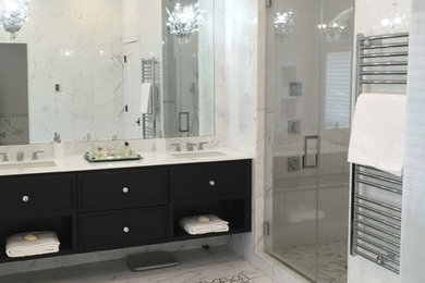 Inspiration for a mid-sized contemporary master white tile and stone tile marble floor bathroom remodel in Toronto with shaker cabinets, black cabinets, a two-piece toilet, white walls, an undermount sink and marble countertops