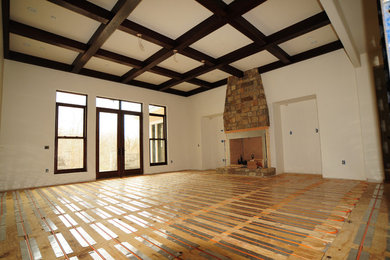 Living room - large mediterranean open concept dark wood floor and brown floor living room idea in Other with white walls, a standard fireplace, a stone fireplace and a media wall