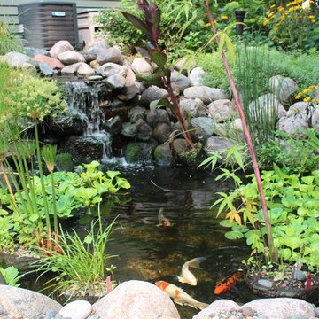 Contemporary Driveway, Mailbox, Plantings, Pond, and Patio
