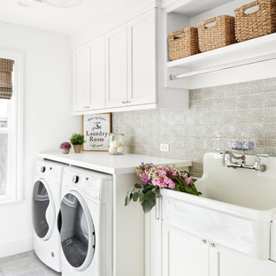 Medium sized classic single-wall separated utility room in San Francisco with an utility sink, shaker cabinets, white cabinets, white walls, a side by side washer and dryer, grey floors, white worktops, quartz worktops and porcelain flooring.