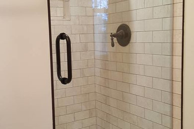 Mid-sized transitional master alcove shower photo in Baltimore with white walls