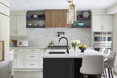 Example of a large transitional u-shaped eat-in kitchen design in Toronto