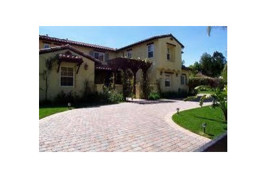 This is an example of a large traditional full sun front yard brick driveway in San Diego for summer.